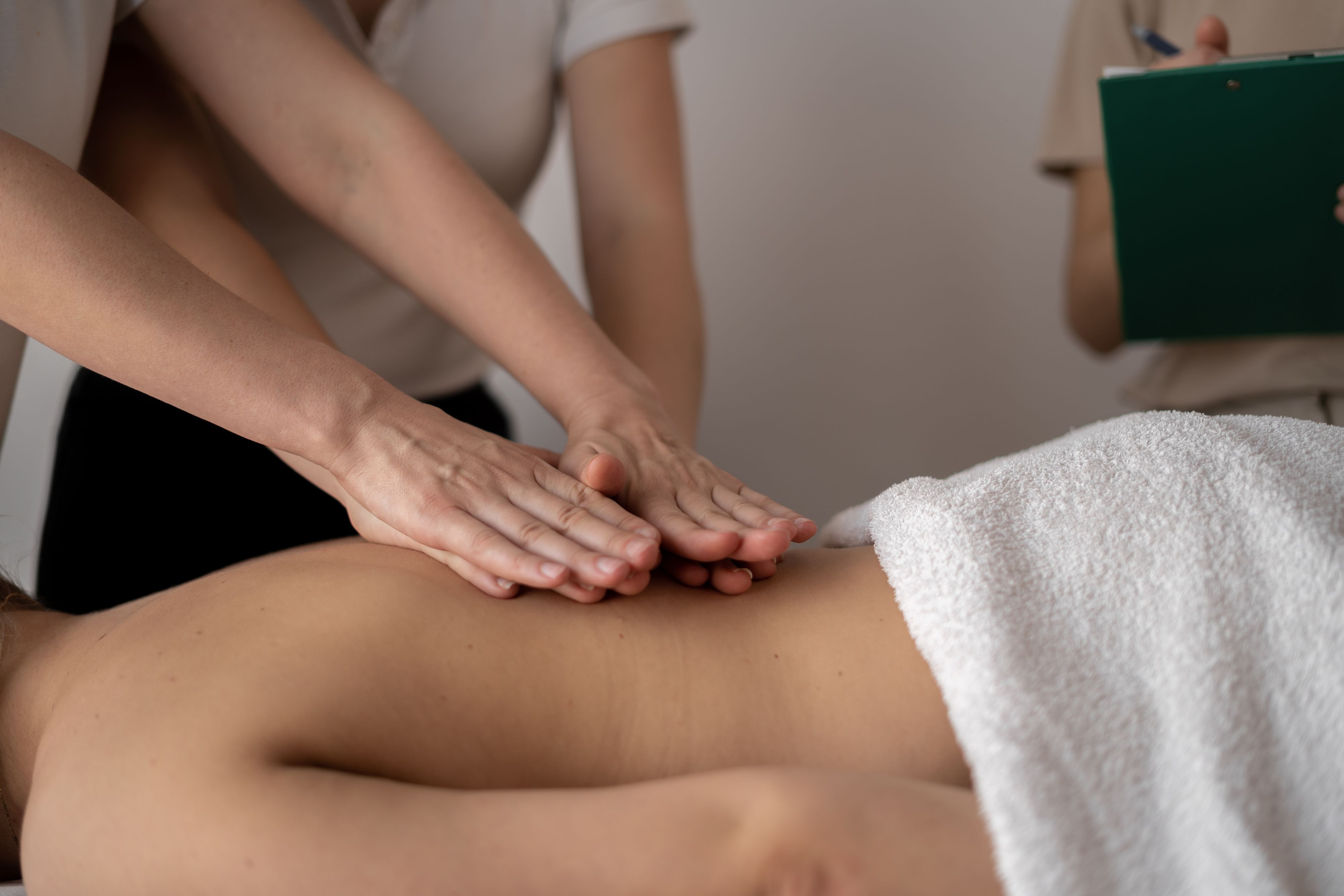 Student learning hands-on massage therapy